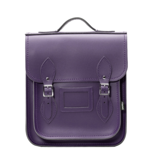 Handmade purple leather city backpack by Zatchels, featuring adjustable straps, premium Scottish leather, and custom sizes for tablets and laptops, embodying elegance and craftsmanship.