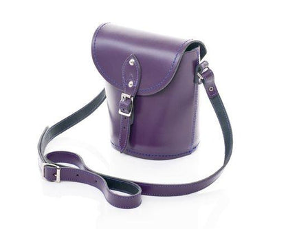 Close-up view of the exquisite purple leather exterior of the Handmade Leather Barrel Bag, highlighting its premium quality and stylish silver nickel buckle.