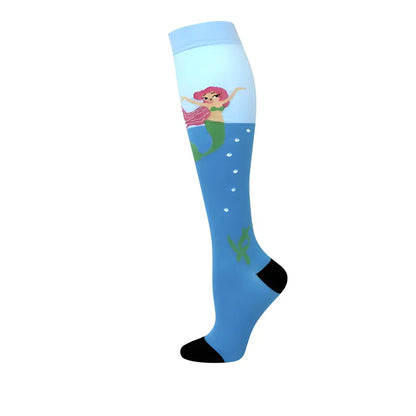 Enchanting Women's Knee Length Compression Travel Socks depicting a charming mermaid design on a blue background, crafted for comfort, style, and circulation.