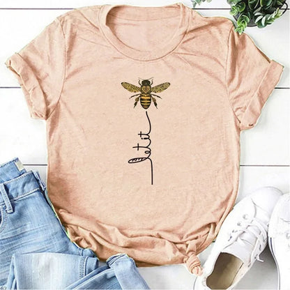 Elegant display of the Bee Kind Women's Graphic Tee by Dazzling Dreams Studio, showcasing its comfortable fit and stylish summer design.