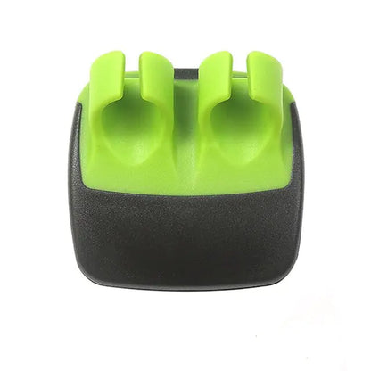 Top-down view of a refined green and black kitchen tool, designed for effortless peeling of fruits and vegetables, highlighting its modern aesthetic.