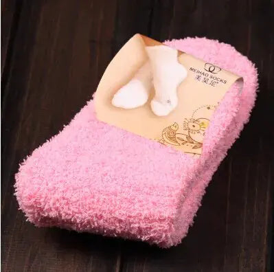 Luxury Women's Bed Socks in soft pink, showcasing the pure color and fluffy texture, perfect for warmth and comfort during winter.