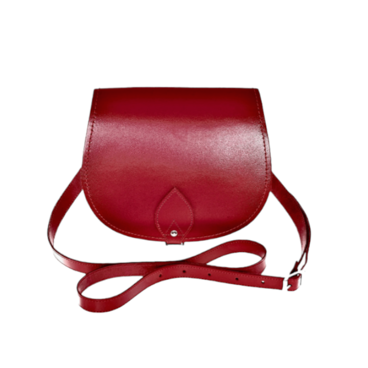 Luxury Handmade Red Leather Saddle Bag showcasing its rich red hue, elegant adjustable cross body strap, and oversized front flap. Available in small and large sizes, perfect for adding sophistication to any outfit.
