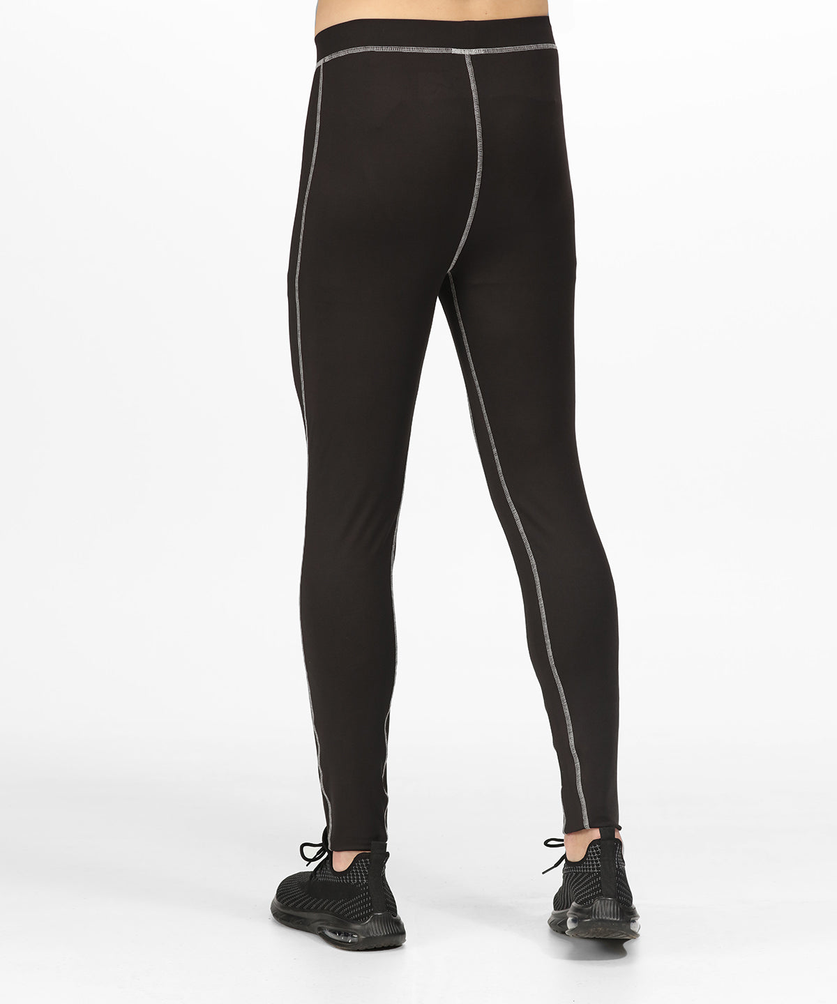 Stylish model wearing Regatta Professional Quick-Dry Baselayer Pants, featuring a fit that emphasises comfort and sophistication in outdoor wear.