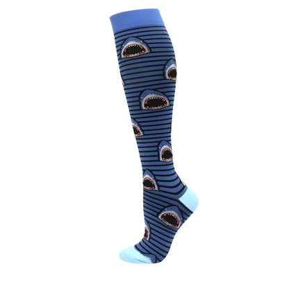 Women's Knee Length Compression Travel Socks for Comfort, Style, and Circulation adorned with vibrant blue shark designs, ideal for adventurous journeys with a playful flair.