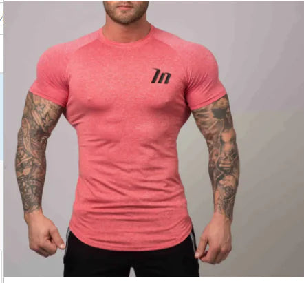 Stylish Forzza Premium Cotton Blend Compression Shirt in vibrant pink, designed for breathability and comfort during workouts, showcasing a sleek fit and athletic style.