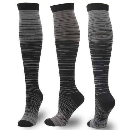 Dazzling Dreams Studio Men's and Women's activewear Flightwear Compression Stockings in elegant grey and black, designed to boost circulation and reduce muscle fatigue while maintaining a chic appearance.