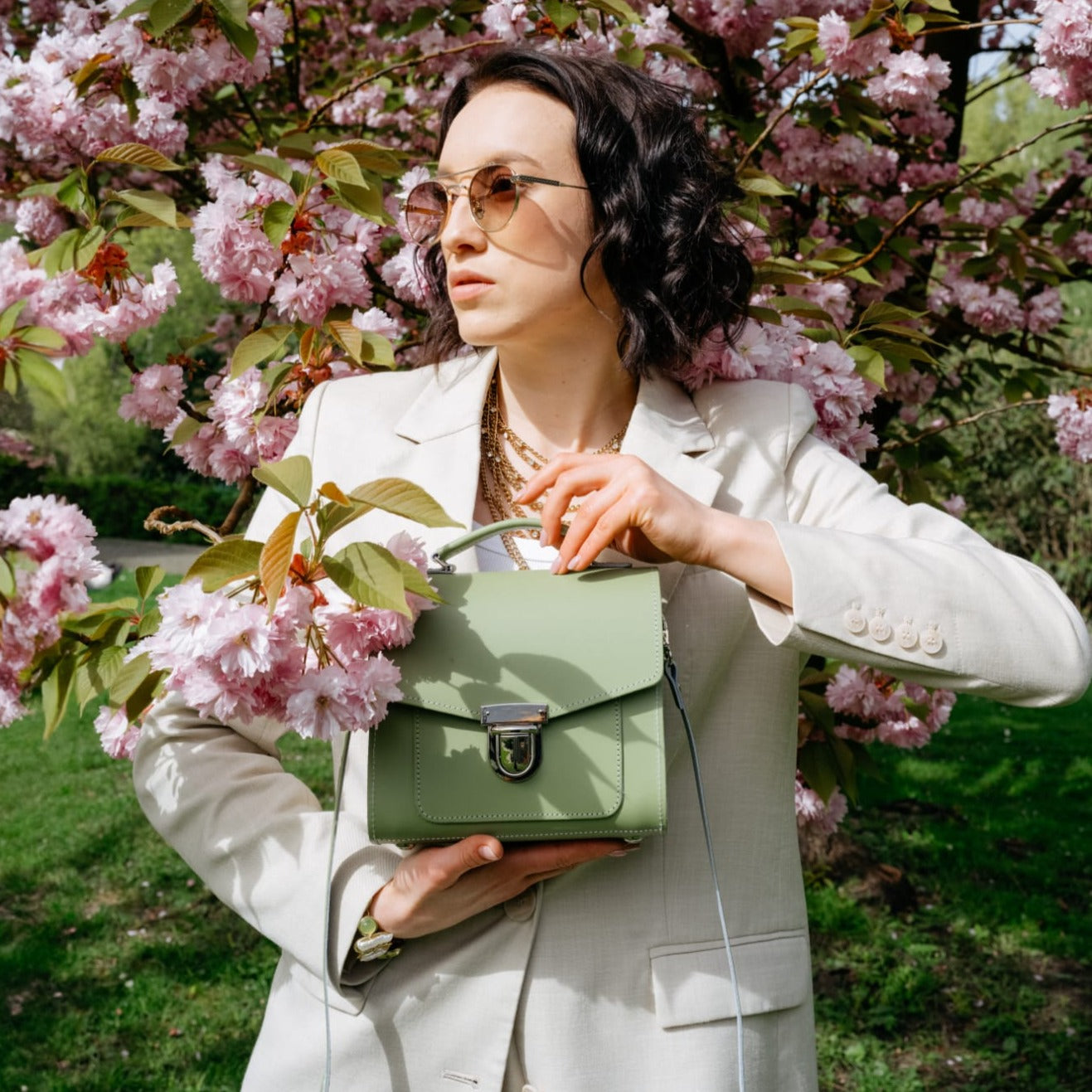 Luxurious Handmade Sage Green Leather Sugarcube Handbag showcasing its elegant design and craftsmanship, perfect for fashion enthusiasts.