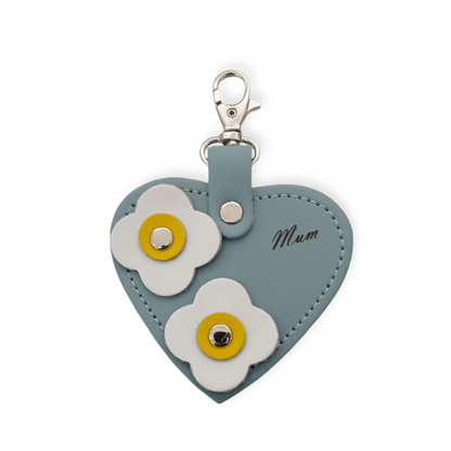 Luxury Sea Green Love Heart Bag Charm featuring elegant 'Mum' engraving and delicate flower appliques, handcrafted in England from premium leather.