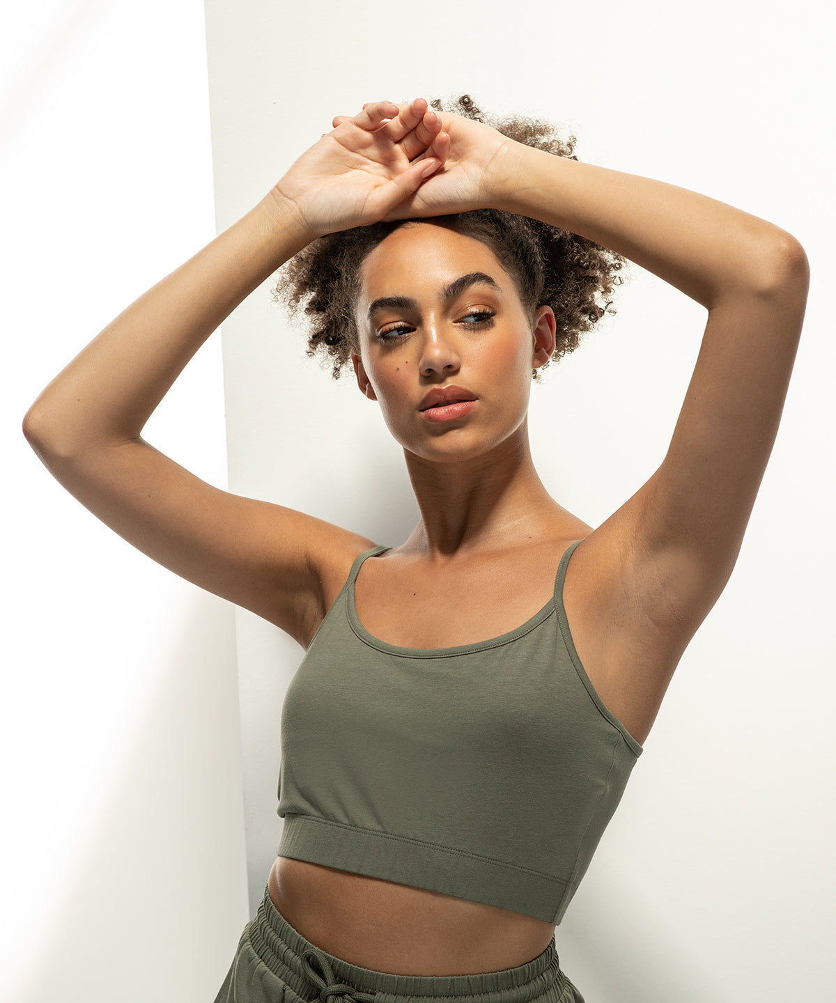 Exquisite cropped rPET cami top showcasing adjustable straps, crafted from a sustainable cotton-polyester blend, embodying elegance and eco-conscious design.