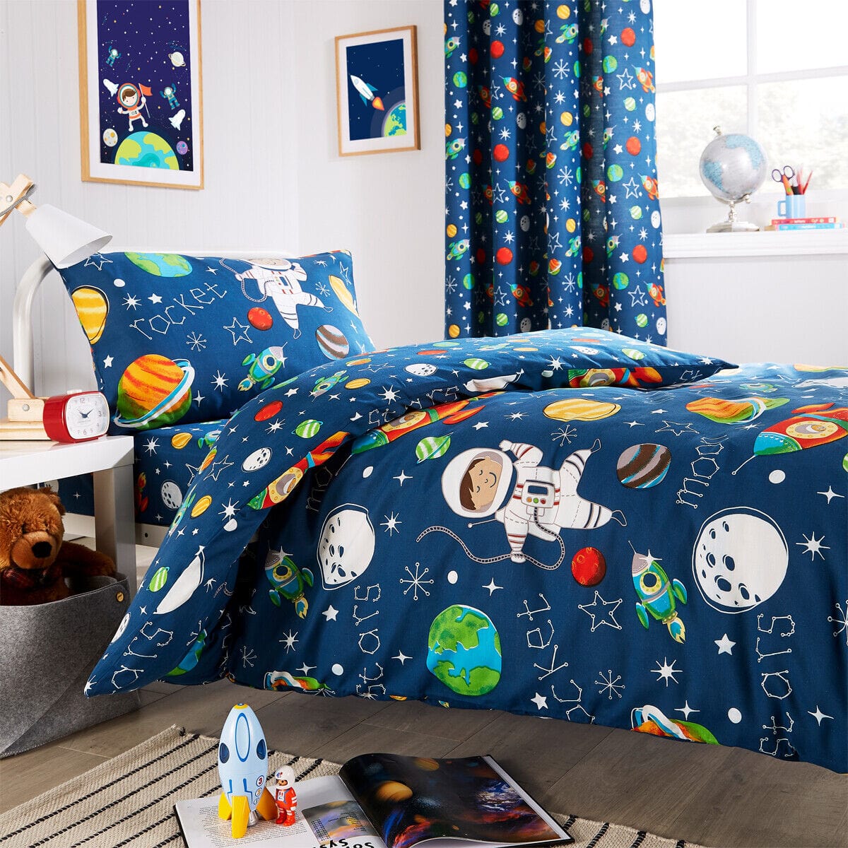 Luxurious Space Explorer Kids Duvet Cover Set by OLIVIA ROCCO showcasing vibrant space-themed design, perfect for stylish children's bedrooms.