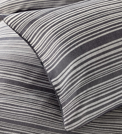Reversible cotton blend duvet cover set featuring sophisticated stripe pattern, ideal for enhancing bedroom decor.