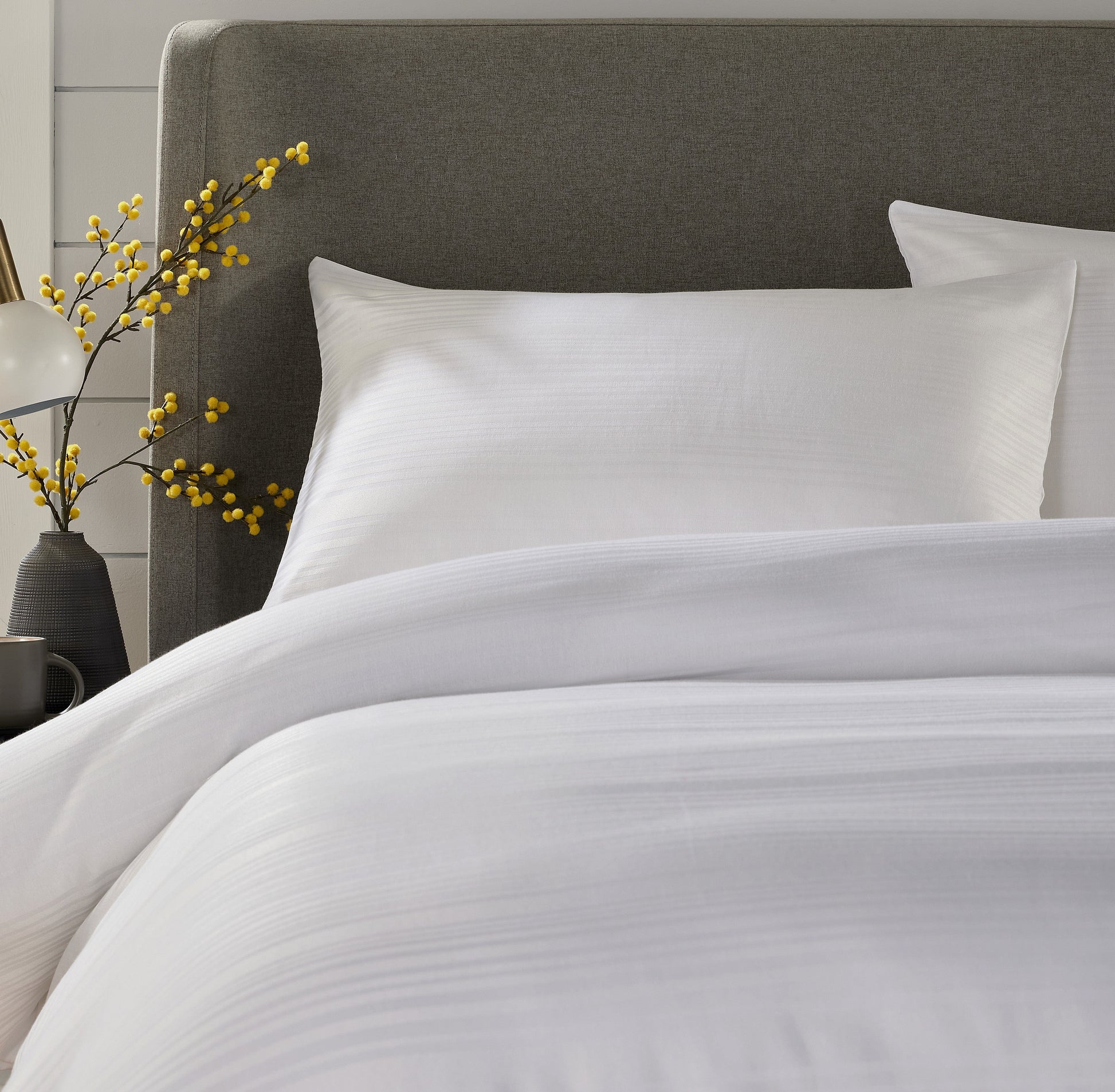 Detail shot of Stripe Jacquard Duvet Cover showcasing the intricate pattern and vibrant colour options, ideal for stylish bedroom decor.