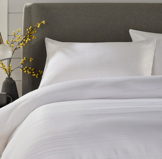 Detail shot of Stripe Jacquard Duvet Cover showcasing the intricate pattern and vibrant colour options, ideal for stylish bedroom decor.