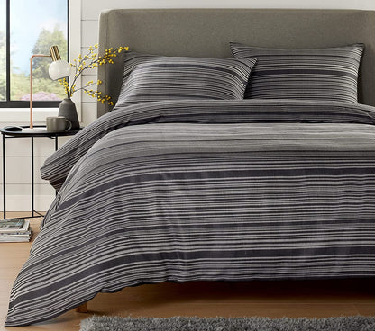 Reversible design of the stripe jacquard duvet cover set by OLIVIA ROCCO, displaying two elegant colour options that enhance bedroom decor.