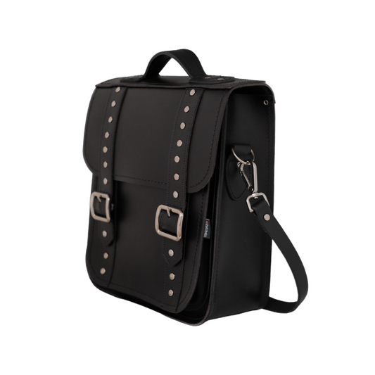 Interior view of the Handmade Black Leather Gothic City Backpack showcasing its spacious compartment and plush black lining, designed for stylish functionality.