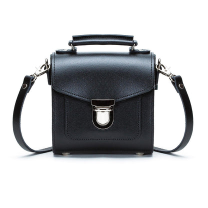 Handmade Black Leather Sugarcube Handbag featuring adjustable strap and chic push lock closure, perfect for luxury style.