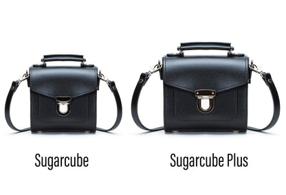 Diverse strap options of the Handmade Zebra Leather Sugarcube Handbag, featuring adjustable and detachable straps for versatile styling across occasions.