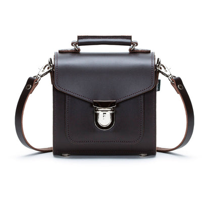Elegant Dark Brown Handmade Leather Sugarcube Handbag showcasing its chic design, adjustable detachable strap, and premium craftsmanship, perfect for any upscale occasion and available in three sizes.
