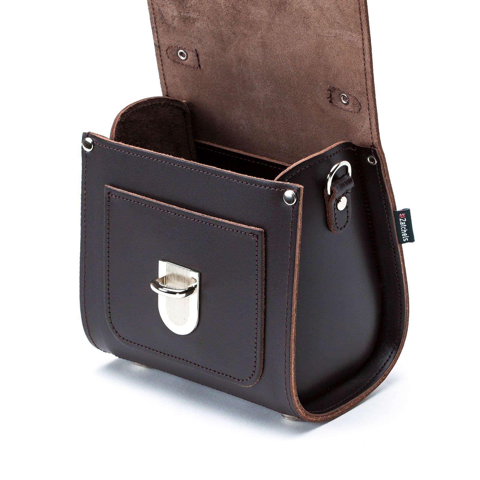 Versatile Dark Brown Sugarcube Handbag modeled as a stylish clutch, highlighting its elegant design and premium leather material.