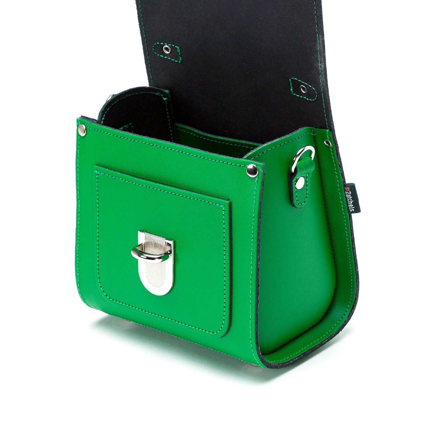 Handmade green leather Sugarcube handbag featuring adjustable crossbody strap and elegant clutch design, perfect for luxury accessorizing.