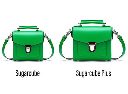 Versatile Sugarcube handbag styled as a crossbody bag, highlighting its trendy silhouette and adjustable strap for modern fashionistas.