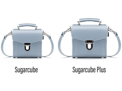 Versatile Handmade Leather Sugarcube Handbag shown in multiple styles: shoulder, crossbody, and clutch, highlighting its adaptability.