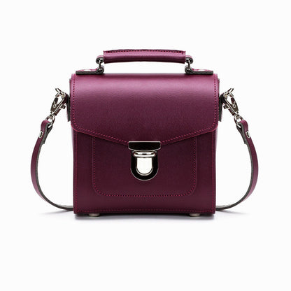 Handmade Marsala Red Leather Sugarcube Handbag showcasing its premium craftsmanship and luxurious design with a trendy push lock closure.