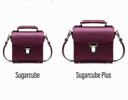 Versatile adjustable and detachable strap of the Handmade Marsala Red Leather Sugarcube Handbag, enabling multiple stylish carrying options.