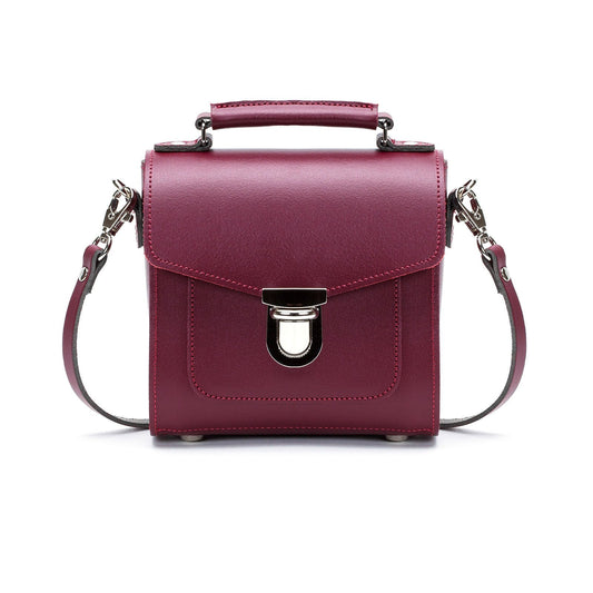 Handmade Oxblood Leather Sugarcube Handbag showcasing its elegant design and rich texture, perfect for stylish outings.