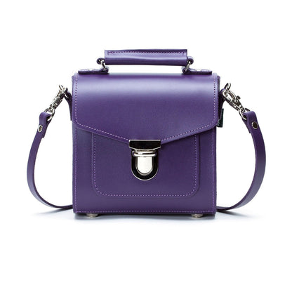 Exquisite Purple Handmade Leather Sugarcube Handbag by Zatchels, showcasing its luxurious design, adjustable strap, and elegant silhouette.
