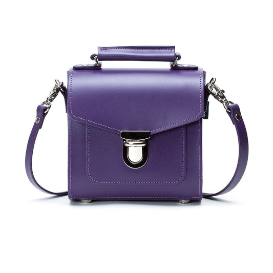 Exquisite Purple Handmade Leather Sugarcube Handbag by Zatchels, showcasing its luxurious design, adjustable strap, and elegant silhouette.