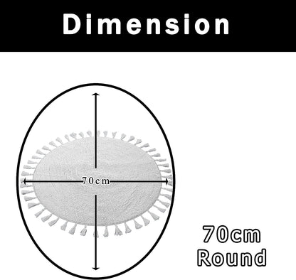 Stylish round bath mat designed with elegant tassels, showcasing its natural white and grey hues, perfect for enhancing bathroom decor.