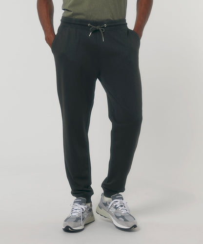 Luxurious unisex organic vintage jogger pants in a unique aged finish, crafted from 100% ring-spun combed cotton, offering comfort and a relaxed fit for sizes XXS to 3XL.