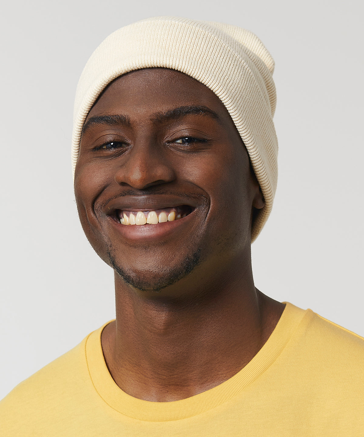 Stylish luxury beanie crafted from organic cotton and recycled polyester, designed for comfort and sustainability with a foldable brim.
