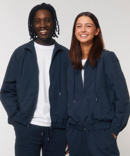 Luxurious lightweight unisex recycled nylon tracksuit top, perfect for sports and casual styles, featuring elegant design for both comfort and performance.