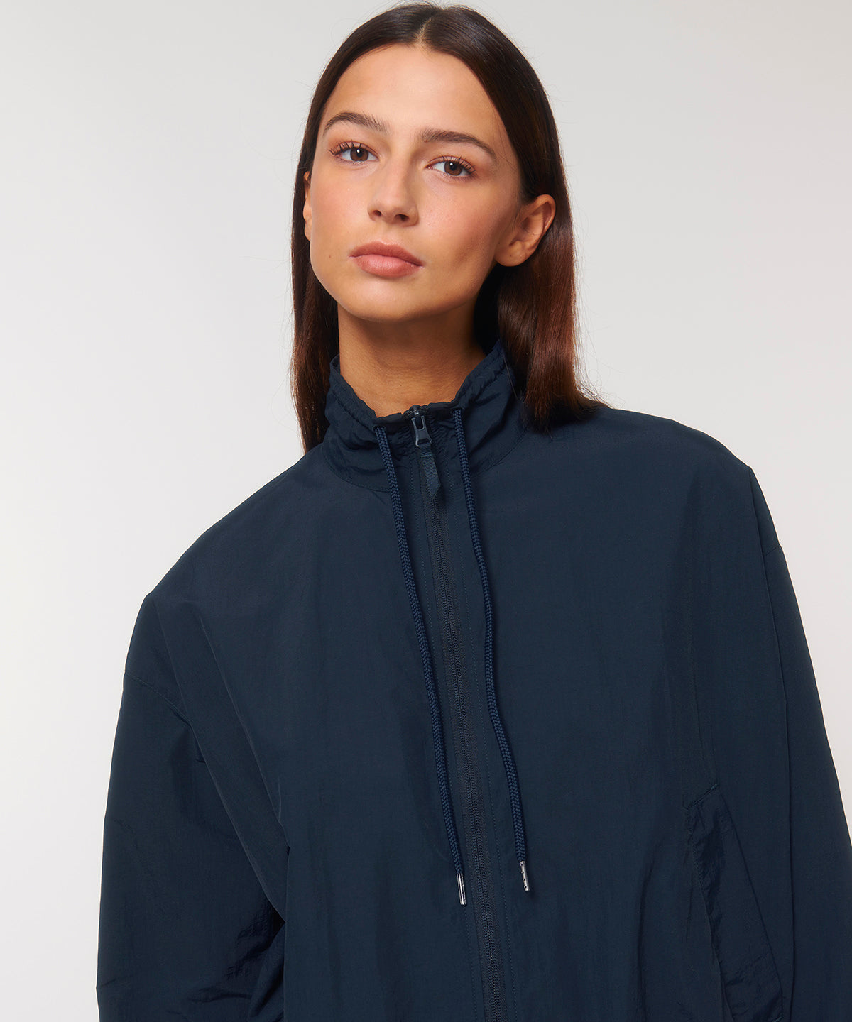 Versatile lightweight tracksuit top for both men and women, crafted from recycled nylon, ideal for chic outdoor activities and casual outings.