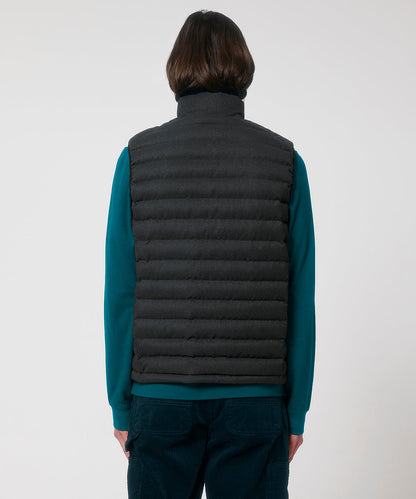 Model wearing the elegant recycled wool-like bodywarmer, demonstrating its versatility as a chic outer layer for any outfit.