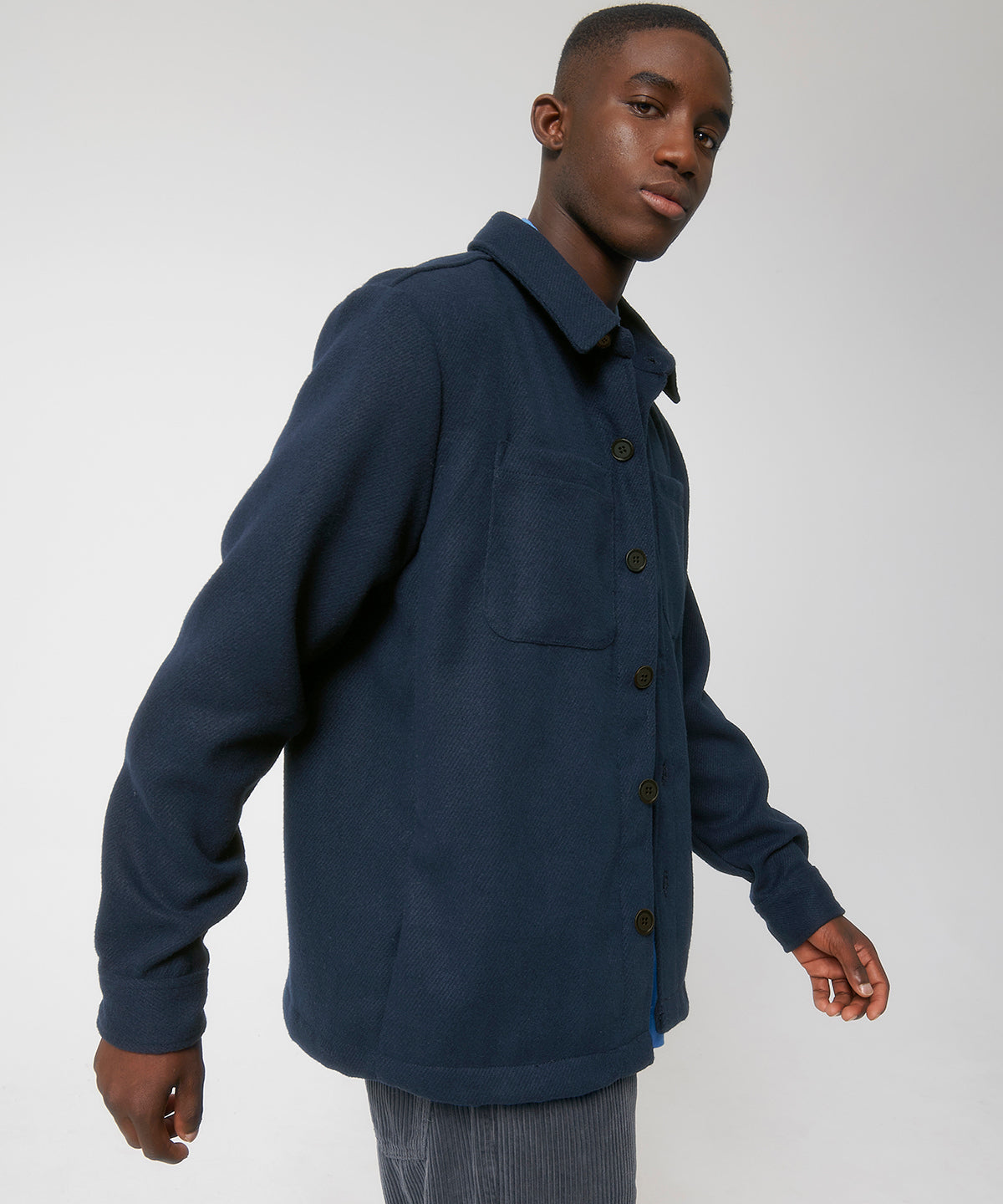 Stylish unisex overshirt jacket made from recycled materials, illustrated with rich textures and sophisticated design.