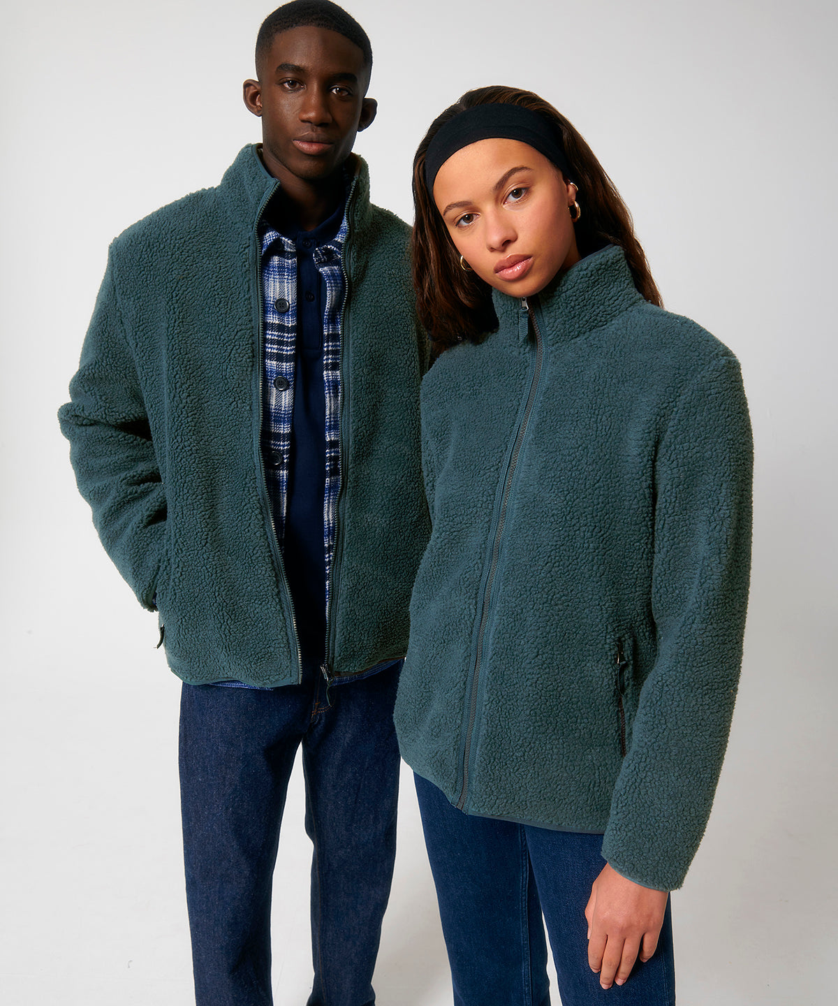 Luxurious unisex recycled sherpa jacket featuring a soft and fluffy texture, ideal for eco-conscious warm layering.