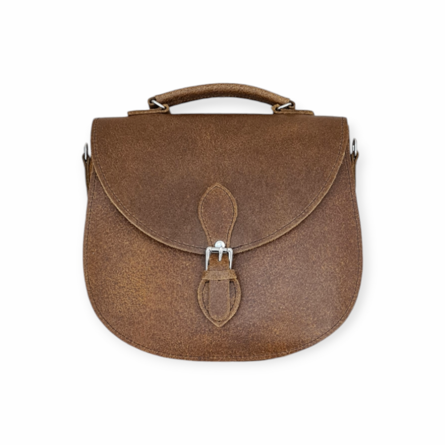 Handmade tan leather saddle bag by Zatchels featuring an adjustable strap and magnetic closure, perfect for stylish everyday use.