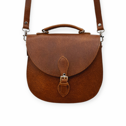 Exquisite Handmade Tan Tannery Leather Saddle Bag, showcasing premium quality craftsmanship with a stylish silver buckle and magnetic closure.