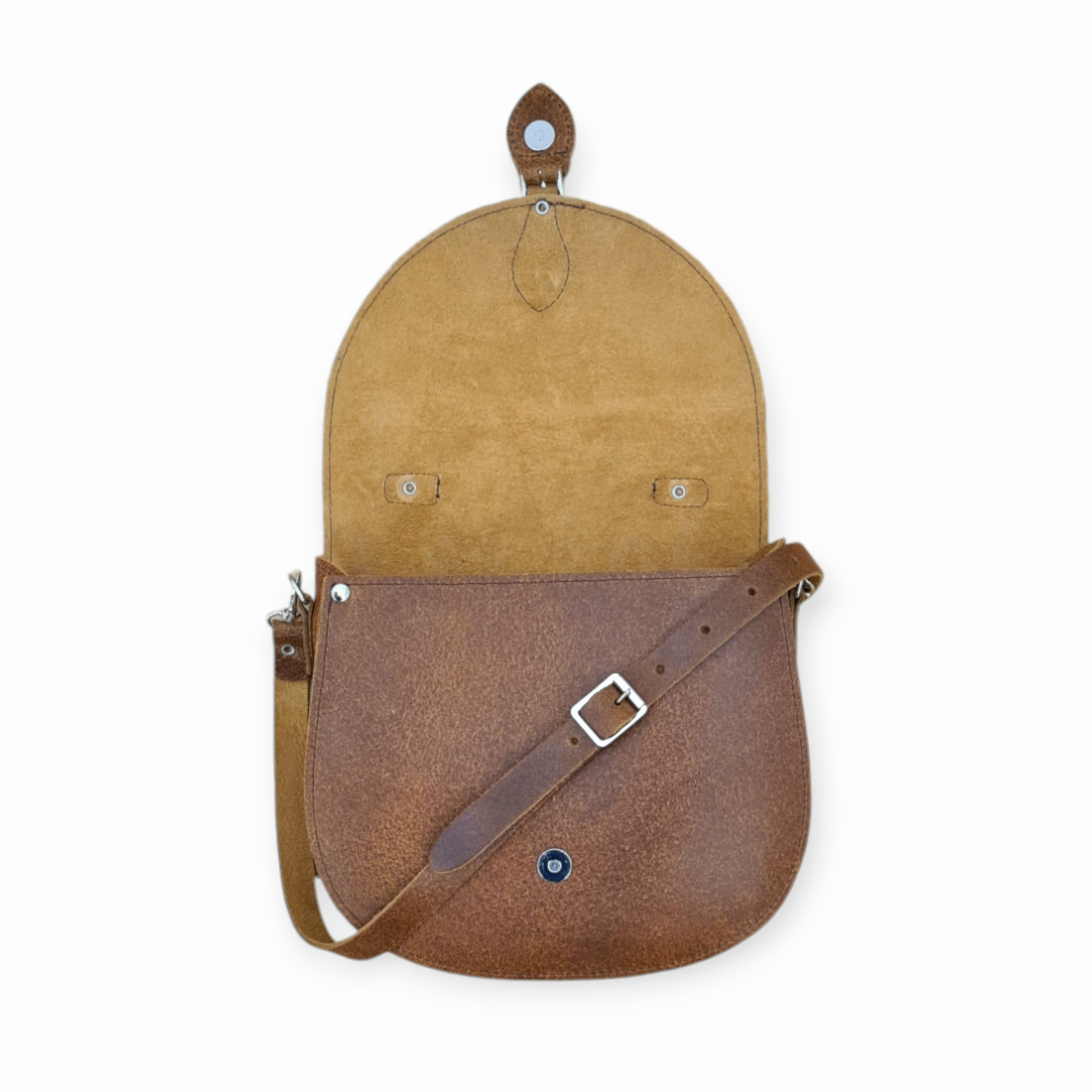 Handmade tan tannery leather saddle bag by Zatchels showcasing elegant design with adjustable strap and magnetic closure, ideal for sophisticated style.