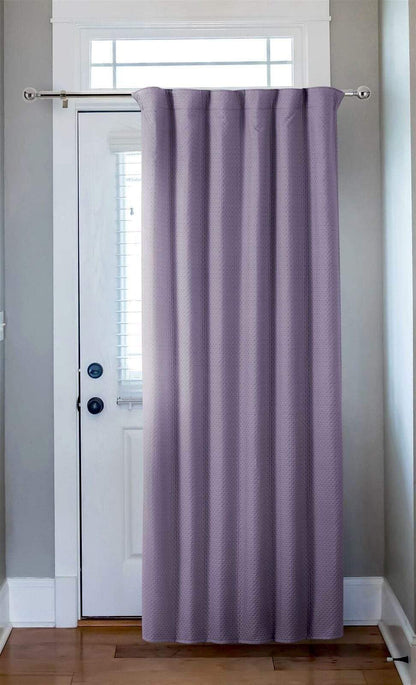 Capri Thermal Door Curtain displayed in a stylish living room setting, illustrating its exquisite drape and ability to complement luxurious interiors.