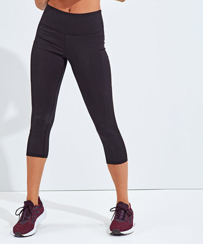 Elegant women's 3/4 length recycled performance leggings with hidden pockets, designed for superior comfort and style, featuring a soft second skin fit, ideal for active lifestyles.