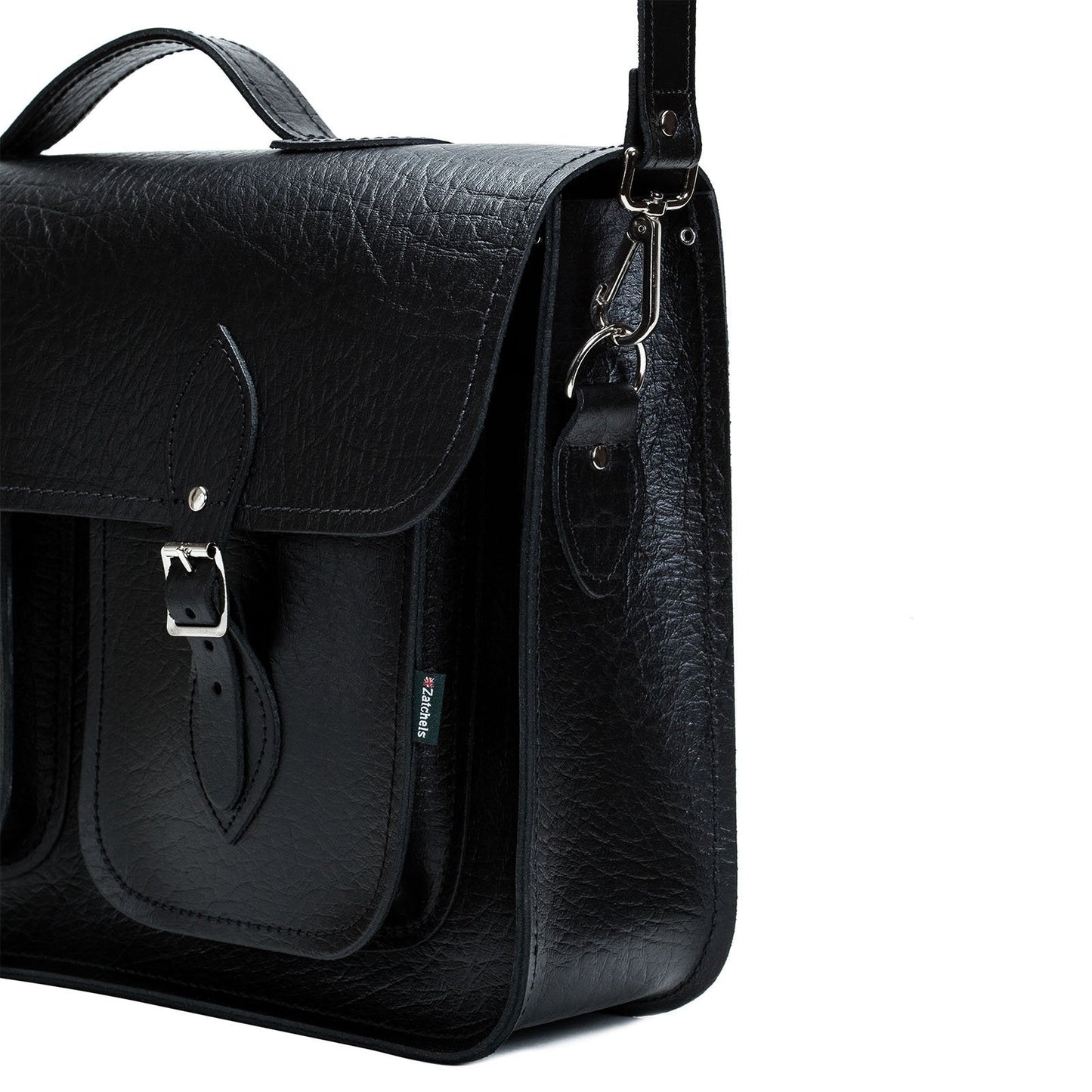 Luxury black twin pocket leather satchel with detachable shoulder strap, ideal for office and travel, combining style and functionality.