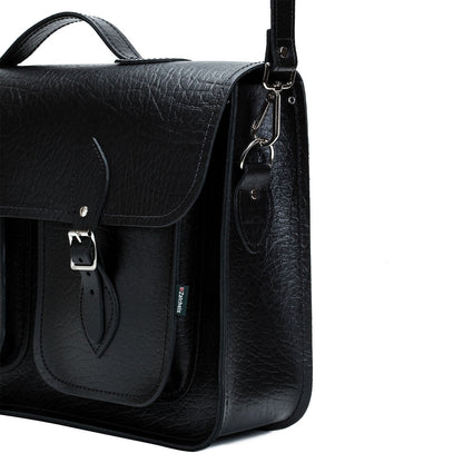 Luxury black twin pocket leather satchel with detachable shoulder strap, ideal for office and travel, combining style and functionality.