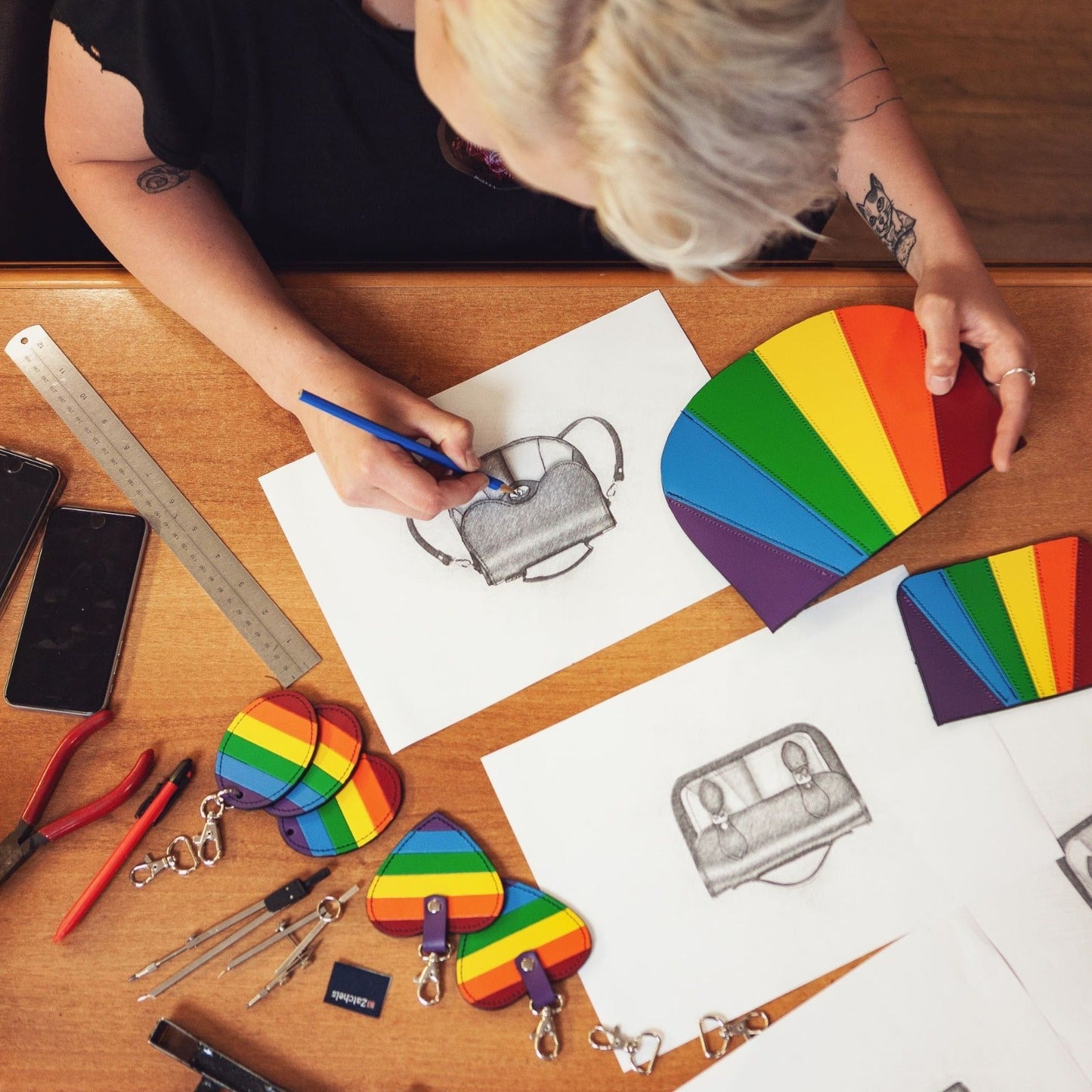 Elegant display of the Handmade Leather Twist Lock Saddle Bag in Pride rainbow colours, highlighting versatility for any occasion.