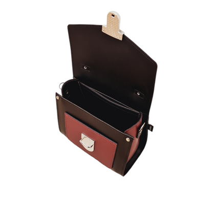 Stylish Black and Oxblood Leather Sugarcube Handbag from Zatchels, featuring an adjustable strap for versatile styling options.