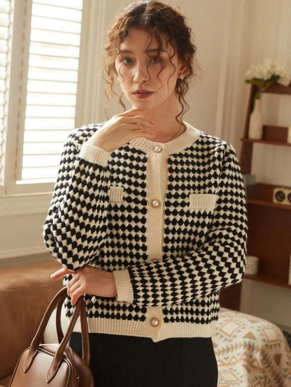 Luxurious Rita Women's Black and White Checkered Blouse with artistic geometric flair by Dazzling Dreams Studio, ideal for making a statement.